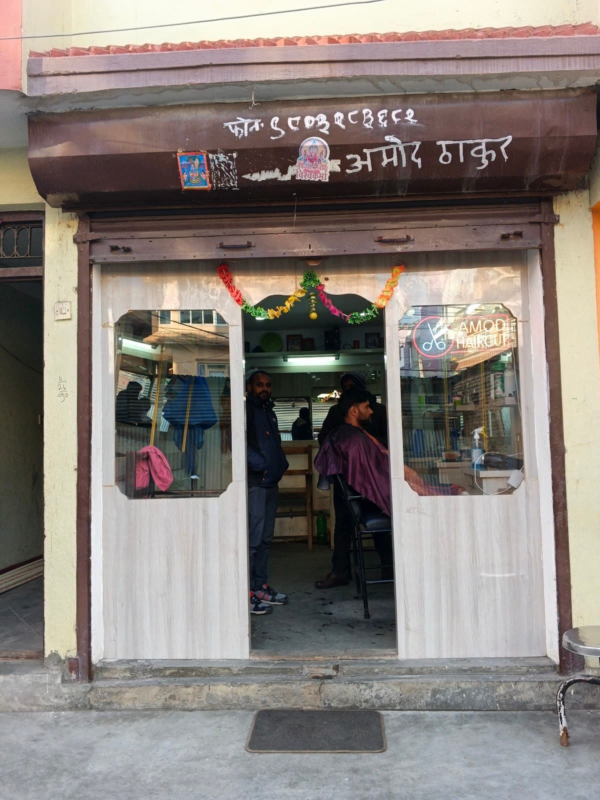 Amod haircut — photo by Bikash Parajuli