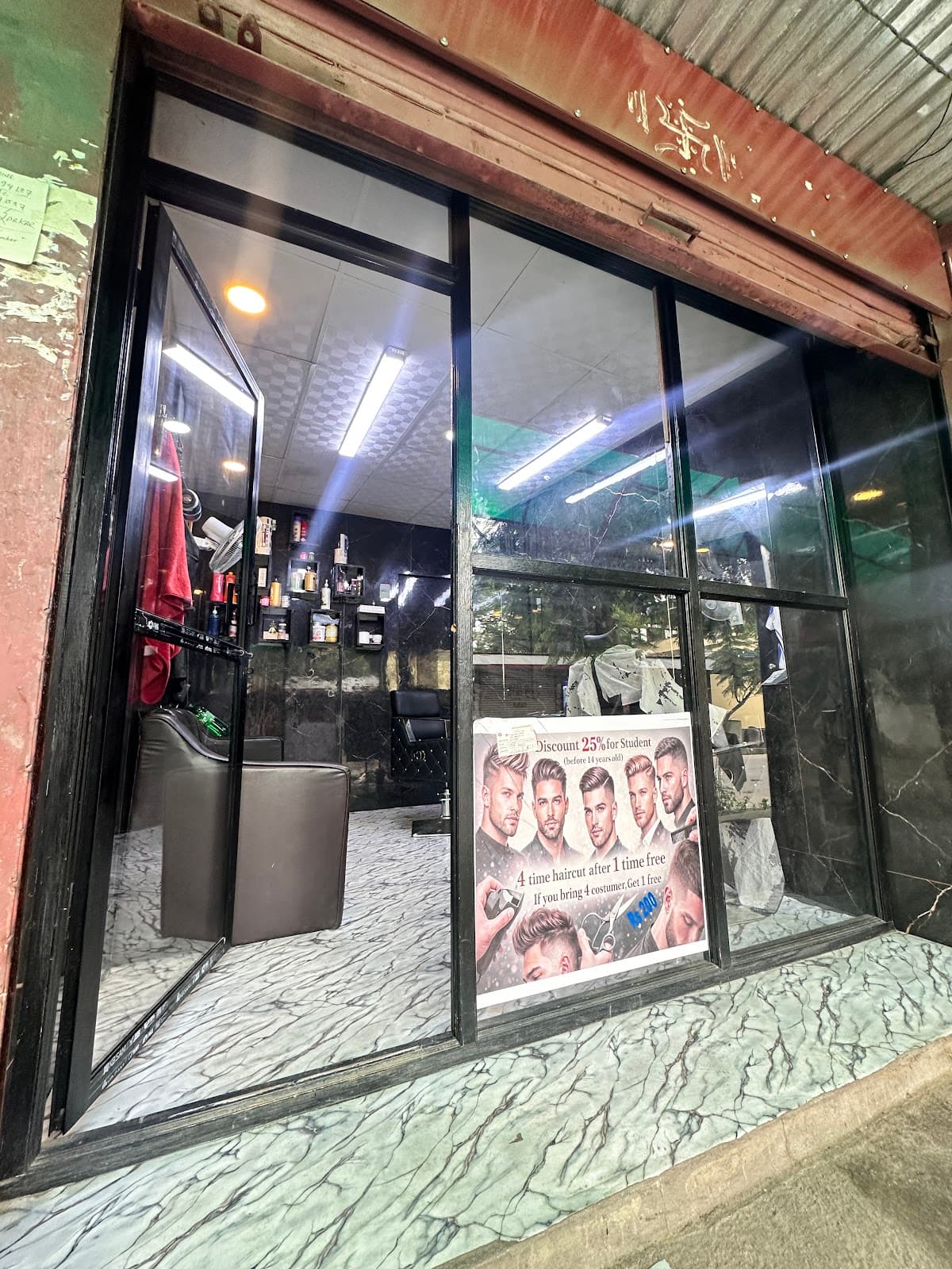GOLAY SARKAR BARBER SHOP — photo by Rosan Tamang Golay