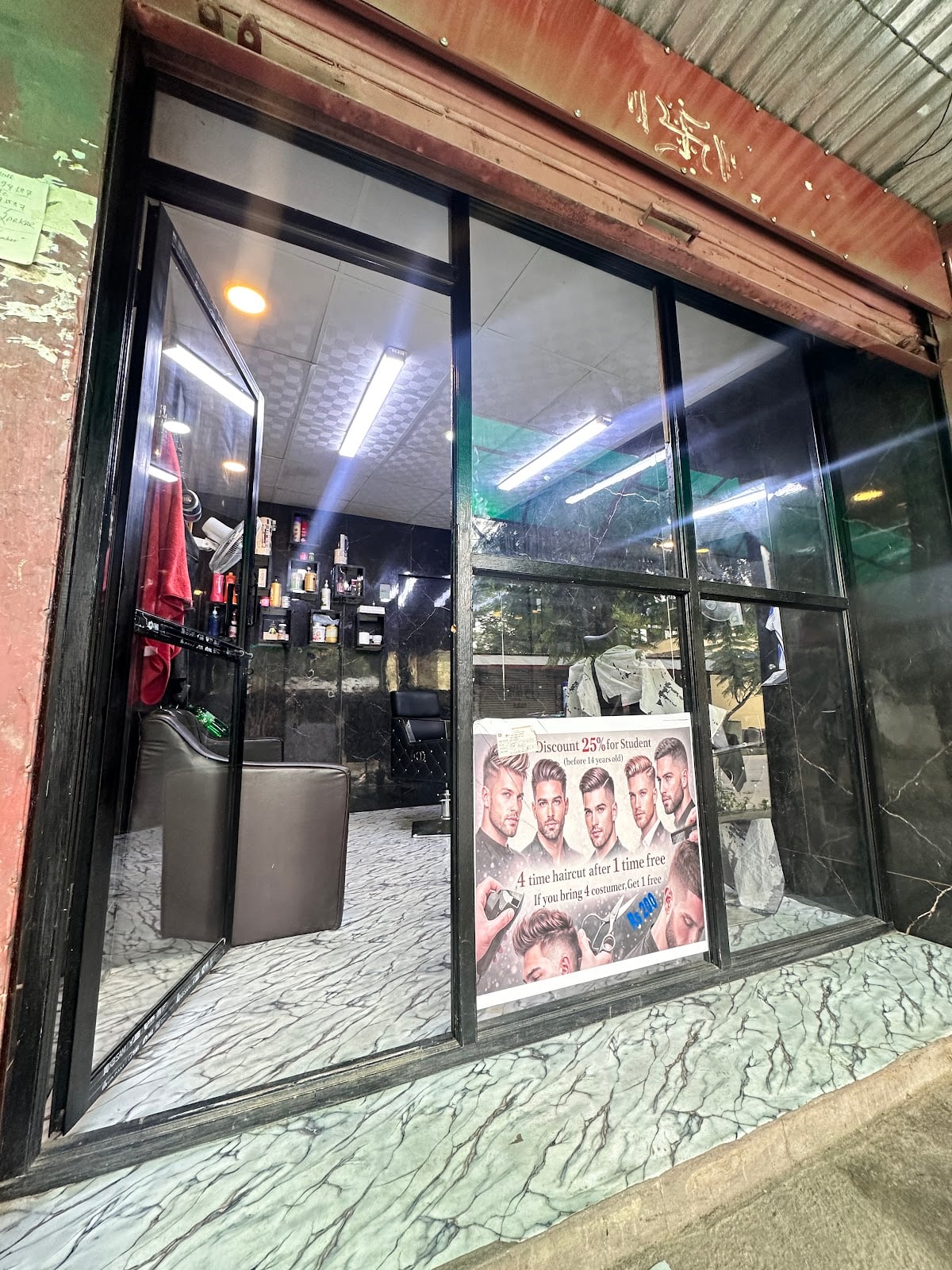 GOLAY SARKAR BARBER SHOP — photo by Rosan Tamang Golay